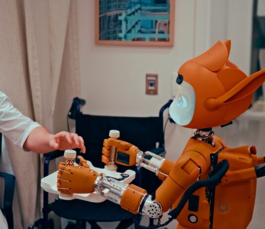 AI와 함께하는 건강관리, 일상에 스며드는 새로운 습관 Man gives robot bottles on a tray