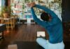 집에서도 간편하게, 건강 챙기는 ‘마이크로 운동’ 열풍 a man doing yoga in a living room